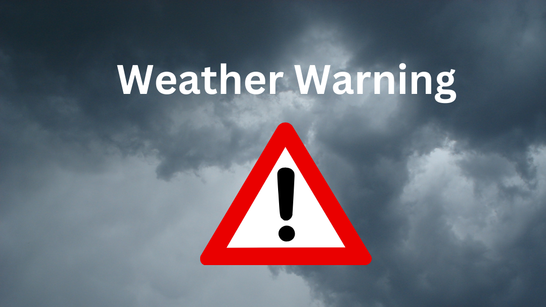 Dark, cloudy sky with the words Weather Warning and a red warning triangle featuring an exclamation mark in the centre, signalling severe weather warnings.